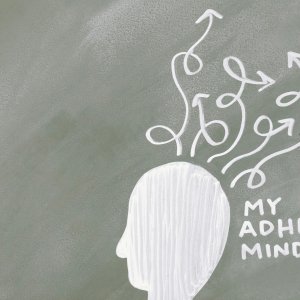 Creative depiction of the ADHD mind with chalk arrows on a green board.